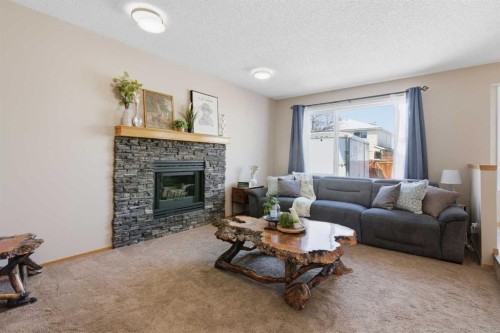 88 Sunmeadows Road Se, Calgary, AB - Indoor Photo Showing Living Room With Fireplace