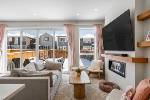 234 Magnolia Way Se, Calgary, AB - Indoor Photo Showing Living Room With Fireplace