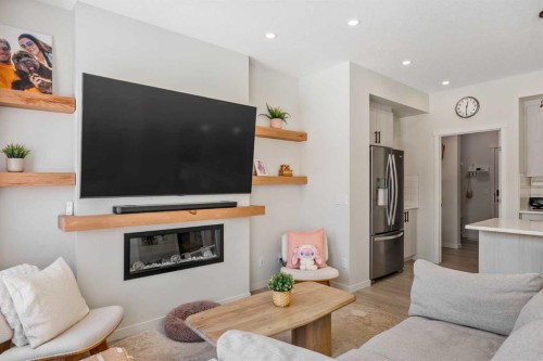 234 Magnolia Way Se, Calgary, AB - Indoor Photo Showing Living Room With Fireplace