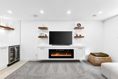 6323 Crowchild Trail Sw, Calgary, AB - Indoor Photo Showing Living Room With Fireplace