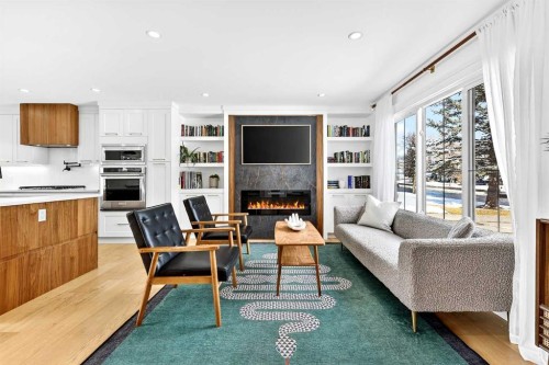 6323 Crowchild Trail Sw, Calgary, AB - Indoor Photo Showing Living Room With Fireplace