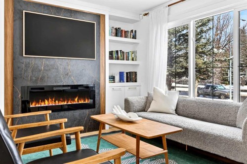 6323 Crowchild Trail Sw, Calgary, AB - Indoor Photo Showing Living Room With Fireplace