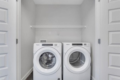 1489 Bayview Point Sw, Airdrie, AB - Indoor Photo Showing Laundry Room