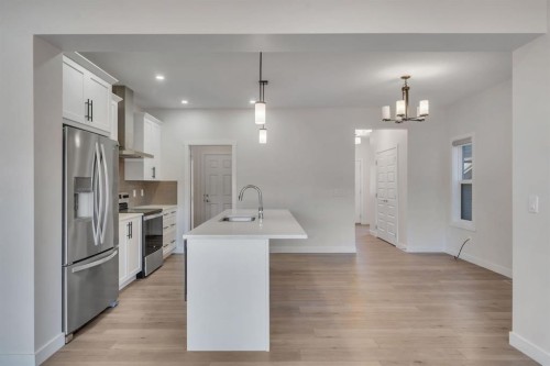 1489 Bayview Point Sw, Airdrie, AB - Indoor Photo Showing Kitchen With Stainless Steel Kitchen