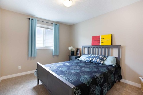 147 Morningside Mews Sw, Airdrie, AB - Indoor Photo Showing Bedroom