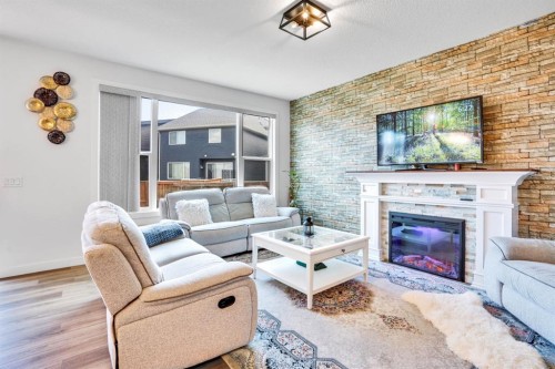 353 Walcrest View Se, Calgary, AB - Indoor Photo Showing Living Room With Fireplace