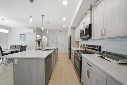 6105-20295 Seton Way Se, Calgary, AB - Indoor Photo Showing Kitchen With Double Sink With Upgraded Kitchen