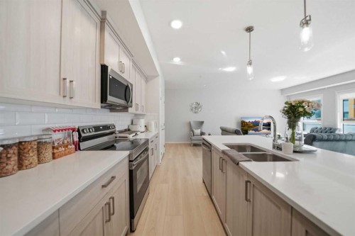 6105-20295 Seton Way Se, Calgary, AB - Indoor Photo Showing Kitchen With Double Sink With Upgraded Kitchen