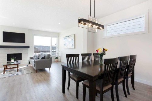 152 Cranbrook Gardens Se, Calgary, AB - Indoor Photo Showing Other Room With Fireplace