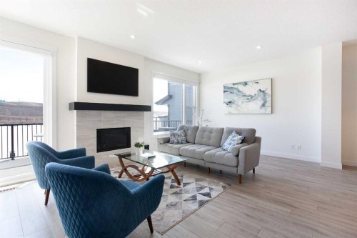 152 Cranbrook Gardens Se, Calgary, AB - Indoor Photo Showing Living Room With Fireplace