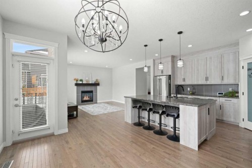 44 Cimarron Springs Circle, Okotoks, AB - Indoor Photo Showing Kitchen With Fireplace With Upgraded Kitchen