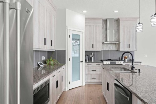 44 Cimarron Springs Circle, Okotoks, AB - Indoor Photo Showing Kitchen With Stainless Steel Kitchen With Double Sink With Upgraded Kitchen