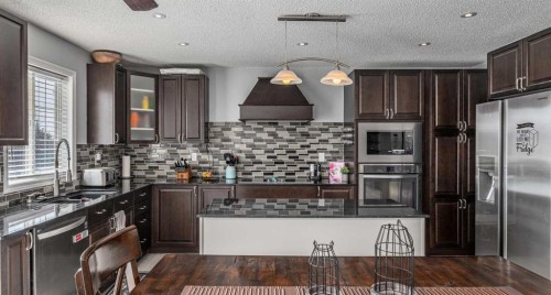 217 Bayside Place Sw, Airdrie, AB - Indoor Photo Showing Kitchen With Stainless Steel Kitchen With Upgraded Kitchen