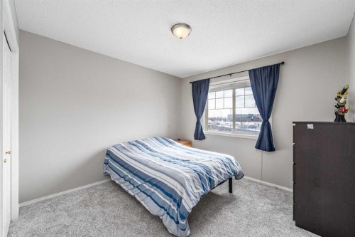 217 Bayside Place Sw, Airdrie, AB - Indoor Photo Showing Bedroom