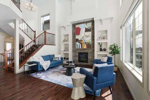 44 Cougar Ridge Green, Calgary, AB - Indoor Photo Showing Other Room With Fireplace