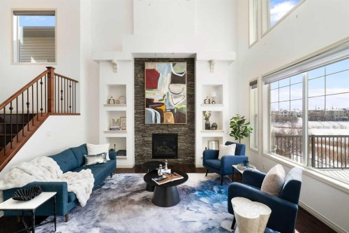 44 Cougar Ridge Green, Calgary, AB - Indoor Photo Showing Living Room With Fireplace