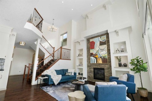 44 Cougar Ridge Green, Calgary, AB - Indoor Photo Showing Living Room With Fireplace