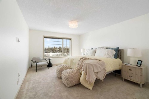 44 Cougar Ridge Green, Calgary, AB - Indoor Photo Showing Bedroom