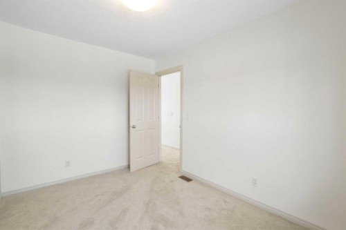 44 Cougar Ridge Green, Calgary, AB - Indoor Photo Showing Other Room