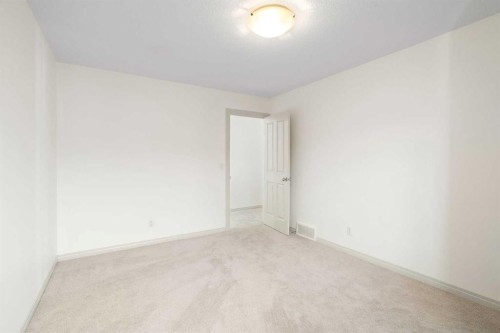 44 Cougar Ridge Green, Calgary, AB - Indoor Photo Showing Other Room