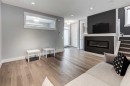 112 Burma Star Road Sw, Calgary, AB  - Indoor Photo Showing Living Room With Fireplace 