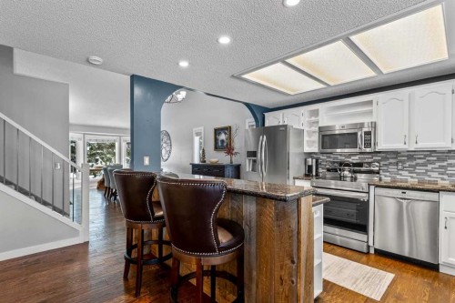 9759 Sanderling Way Nw, Calgary, AB - Indoor Photo Showing Kitchen With Stainless Steel Kitchen With Upgraded Kitchen