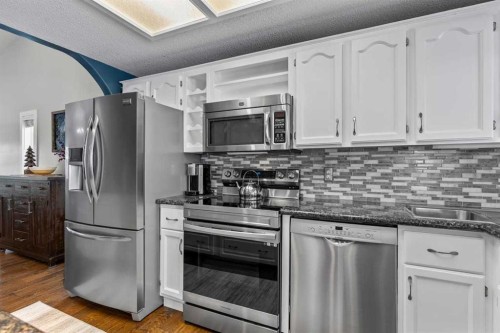 9759 Sanderling Way Nw, Calgary, AB - Indoor Photo Showing Kitchen With Stainless Steel Kitchen With Upgraded Kitchen