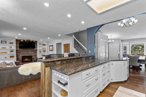 9759 Sanderling Way Nw, Calgary, AB - Indoor With Fireplace