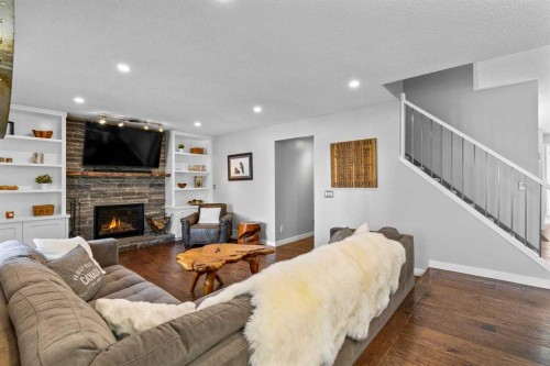 9759 Sanderling Way Nw, Calgary, AB - Indoor Photo Showing Living Room With Fireplace