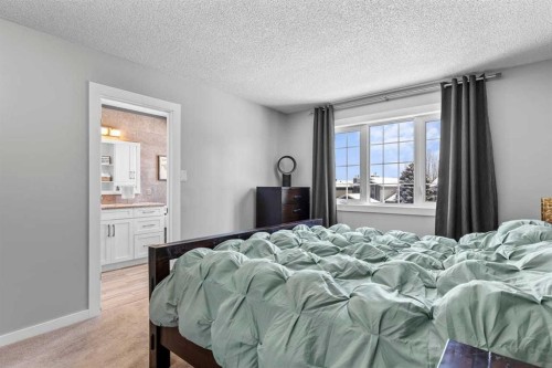9759 Sanderling Way Nw, Calgary, AB - Indoor Photo Showing Bedroom