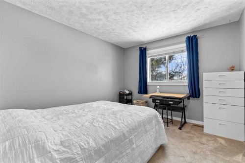 9759 Sanderling Way Nw, Calgary, AB - Indoor Photo Showing Bedroom