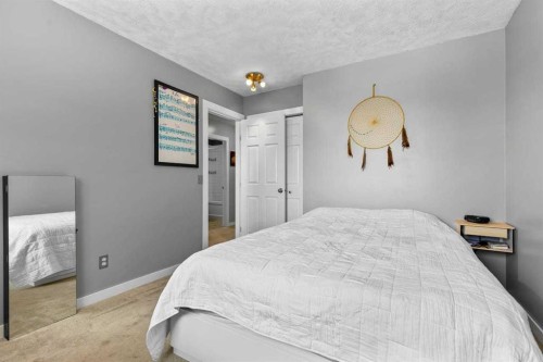 9759 Sanderling Way Nw, Calgary, AB - Indoor Photo Showing Bedroom