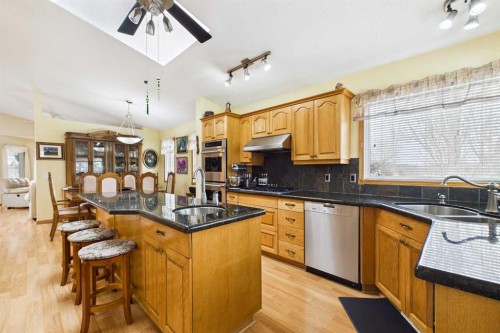 535 Cimarron Point, Okotoks, AB - Indoor Photo Showing Kitchen With Double Sink