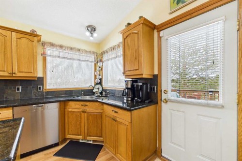535 Cimarron Point, Okotoks, AB - Indoor Photo Showing Kitchen With Double Sink