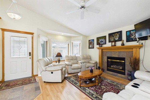 535 Cimarron Point, Okotoks, AB - Indoor Photo Showing Living Room With Fireplace