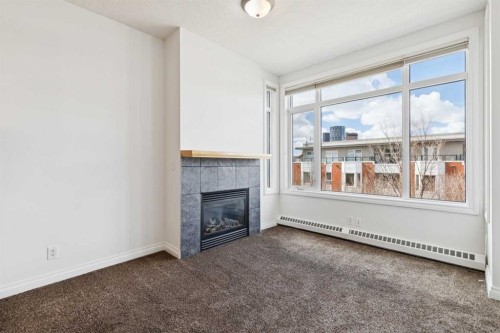 425-910 Centre Avenue Ne, Calgary, AB - Indoor With Fireplace