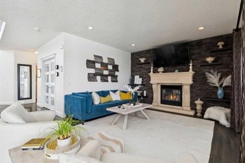 129 Mt Douglas Circle Se, Calgary, AB - Indoor Photo Showing Living Room With Fireplace