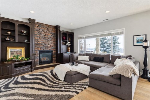 129 Mt Douglas Circle Se, Calgary, AB - Indoor Photo Showing Living Room With Fireplace