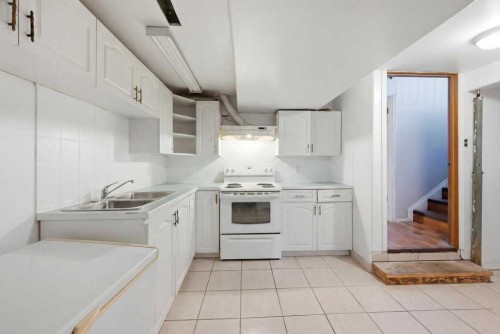 228 Castleridge Drive Ne, Calgary, AB - Indoor Photo Showing Kitchen With Double Sink