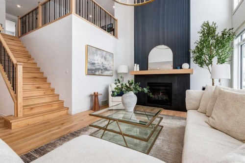 34 Rowmont Grove Nw, Calgary, AB - Indoor Photo Showing Living Room With Fireplace