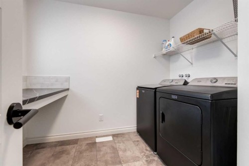 34 Rowmont Grove Nw, Calgary, AB - Indoor Photo Showing Laundry Room