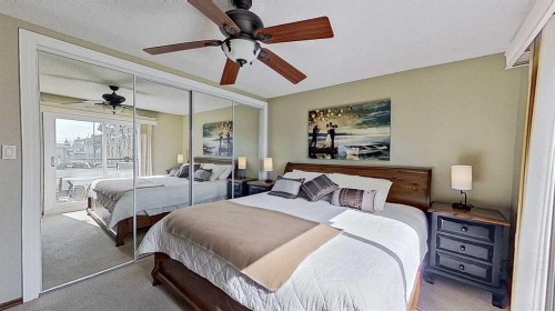 5801/5803 Dalgleish Road Nw, Calgary, AB - Indoor Photo Showing Bedroom