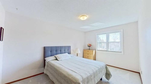 5801/5803 Dalgleish Road Nw, Calgary, AB - Indoor Photo Showing Bedroom