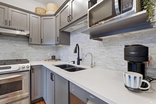 54 Wentworth Common Sw, Calgary, AB - Indoor Photo Showing Kitchen With Double Sink With Upgraded Kitchen