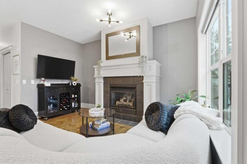 54 Wentworth Common Sw, Calgary, AB - Indoor With Fireplace