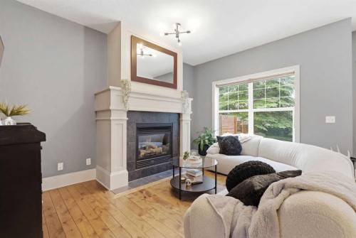 54 Wentworth Common Sw, Calgary, AB - Indoor Photo Showing Living Room With Fireplace
