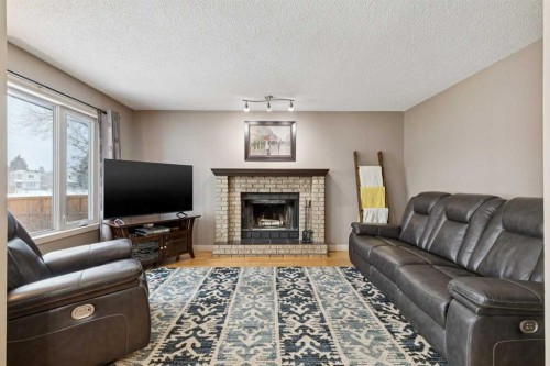 168 Erin Meadow Close Se, Calgary, AB - Indoor Photo Showing Living Room With Fireplace