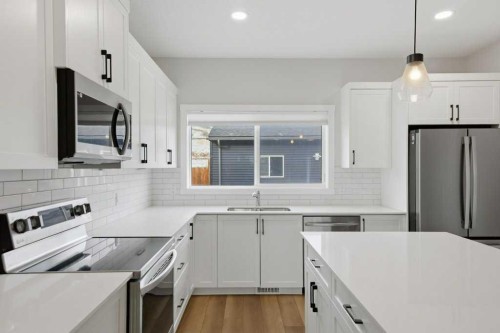 311 Wolf Creek Way Se, Calgary, AB - Indoor Photo Showing Kitchen With Stainless Steel Kitchen With Upgraded Kitchen