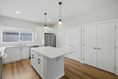 311 Wolf Creek Way Se, Calgary, AB - Indoor Photo Showing Kitchen With Upgraded Kitchen