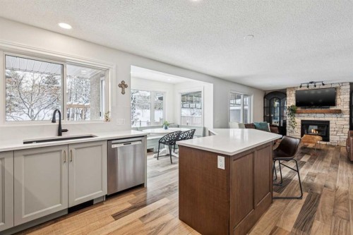 179 Mt Copper Park Se, Calgary, AB - Indoor Photo Showing Kitchen With Fireplace